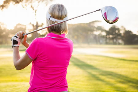 woman playing golf by vcpt